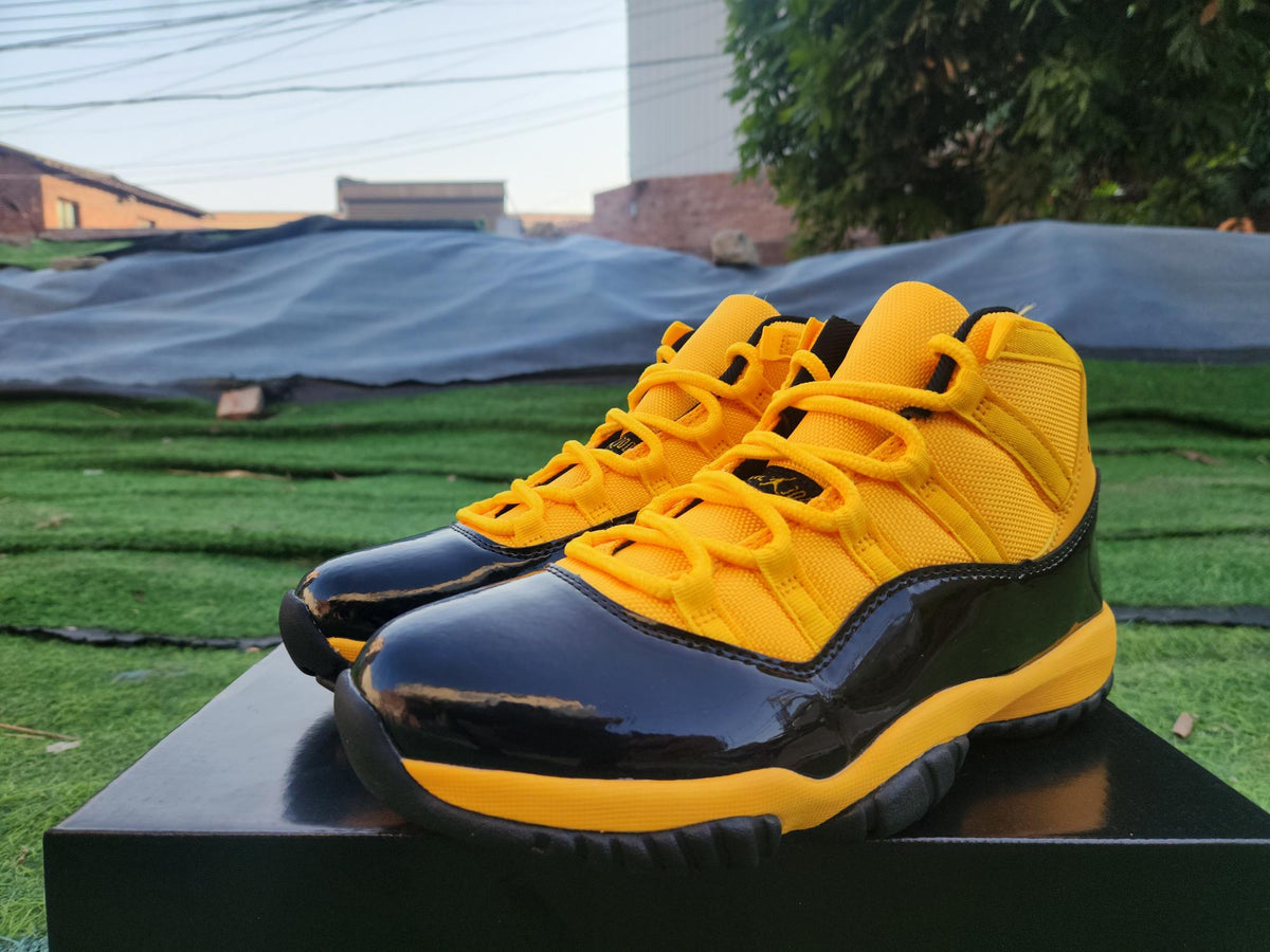 Air Jordan 11 Yellow and Black High-Top Sneakers
