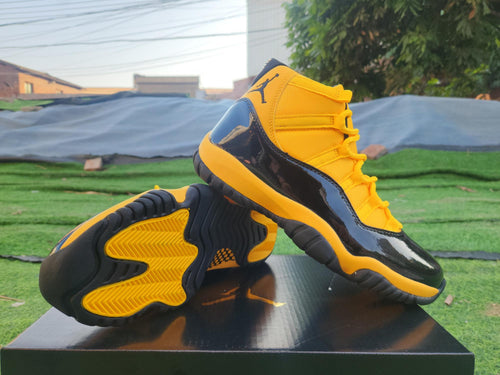 Air Jordan 11 Yellow and Black High-Top Sneakers