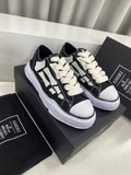 AMIRI Black Low-Top Sneakers with White Bone Appliqués
