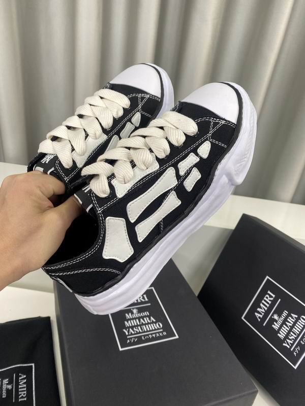 AMIRI Black Low-Top Sneakers with White Bone Appliqués