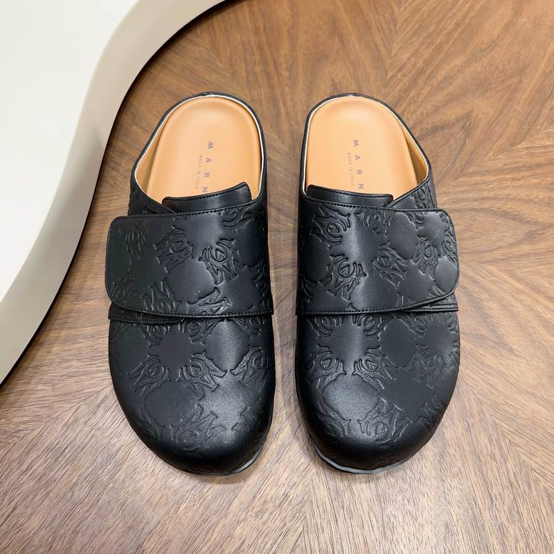 Black All-Over Embossed Slip-On Mules