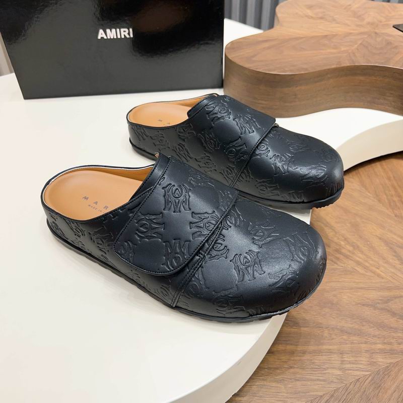 Black All-Over Embossed Slip-On Mules