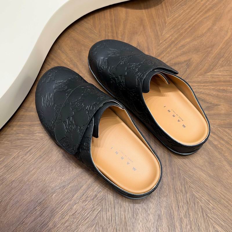 Black All-Over Embossed Slip-On Mules