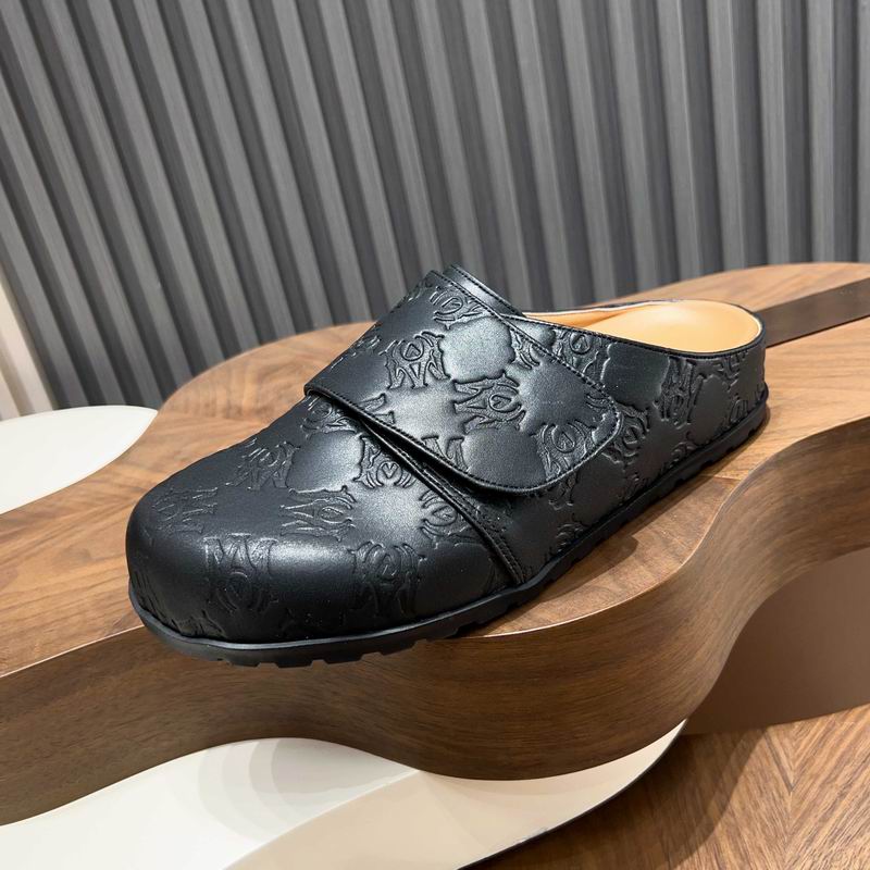 Black All-Over Embossed Slip-On Mules