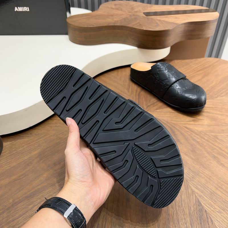 Black All-Over Embossed Slip-On Mules