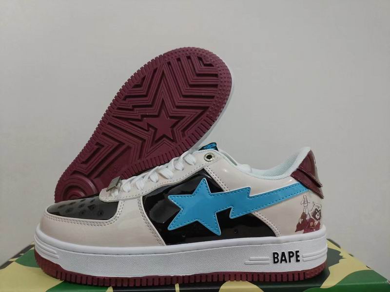 BAPE Cream and Black Low-Top Sneakers with Blue Star Details